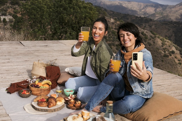 Smiley friends taking selfie full shot