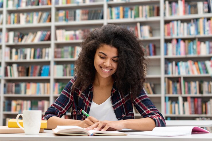 Free Photo smiley girl concentrated on study