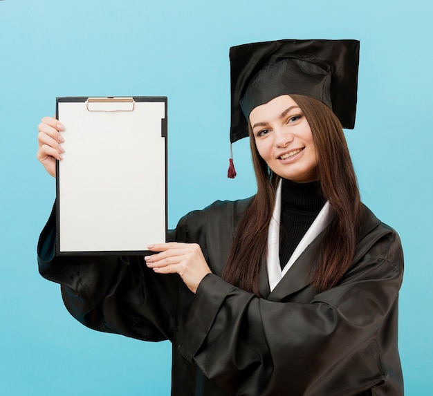 Smiley girl holding clipboard