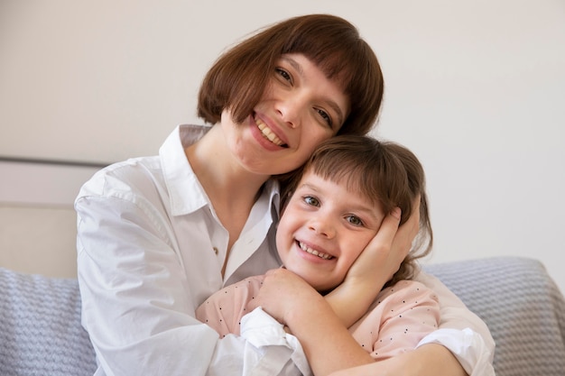 Smiley girl and mother medium shot