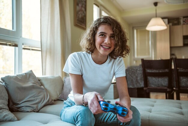 Smiley girl playing a video game