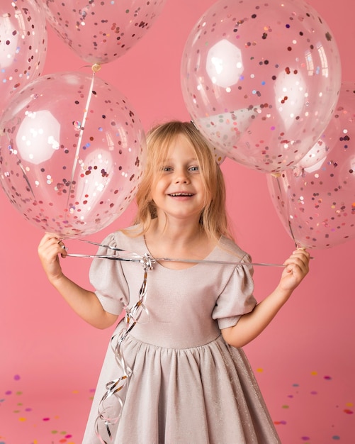 Smiley girl with balloons in costume