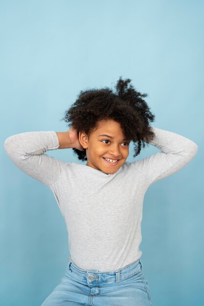 Smiley girl with blue background front view