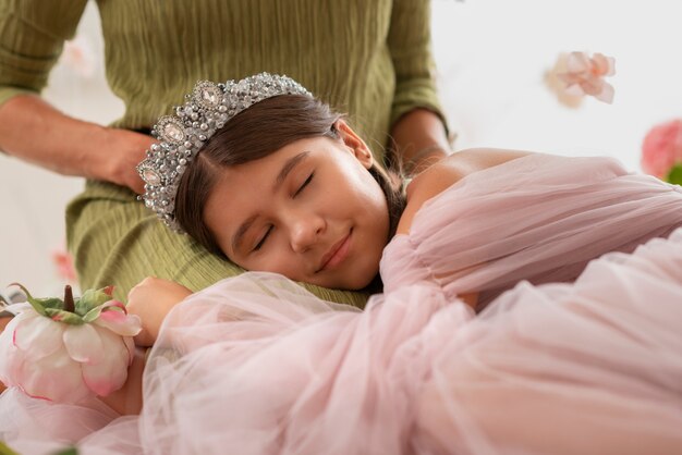 Smiley girl with princess dress side view