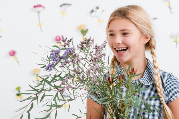 Smiley girl with spring flowers