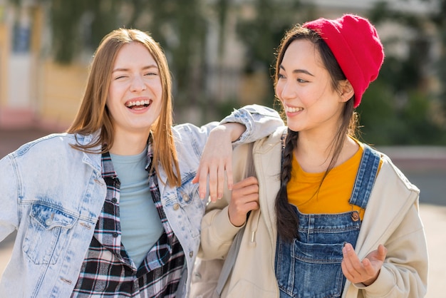 Smiley girlfriends enjoying the time