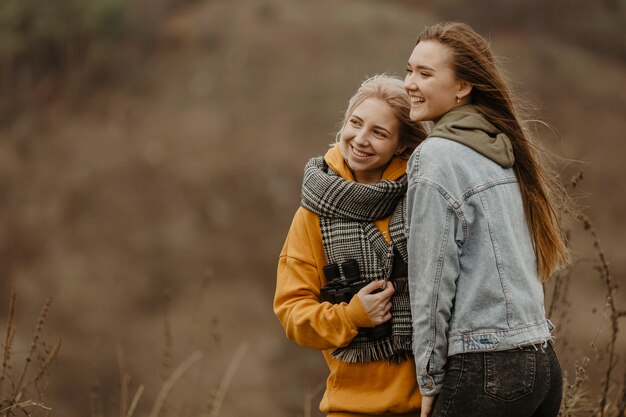 Smiley girlfriends on a winter trip