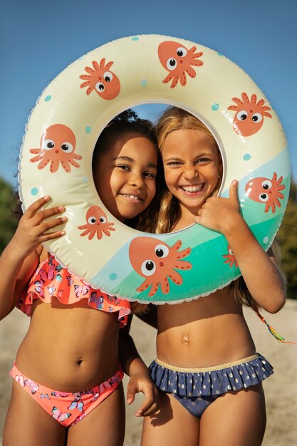 Smiley girls at beach front view