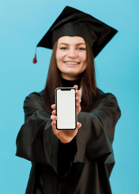Smiley graduate student with phone