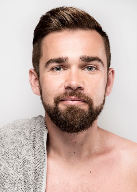 Smiley handsome man posing shirtless