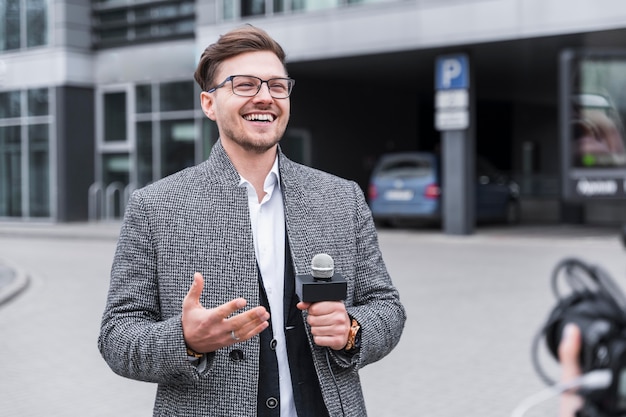 Free photo smiley journalist at job