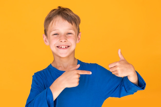 Smiley kid showing the like sign