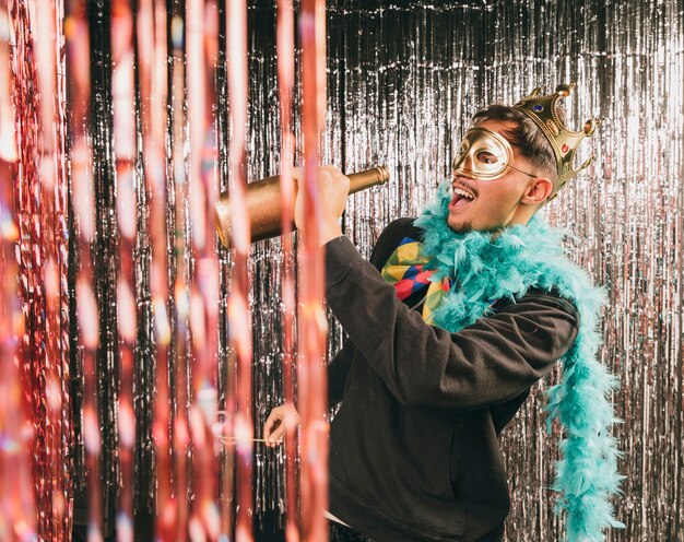 Smiley male with champagne bottle having fun