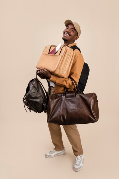 Smiley man carrying bags full shot