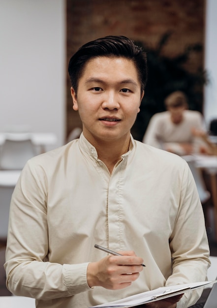 Smiley man holding project documents