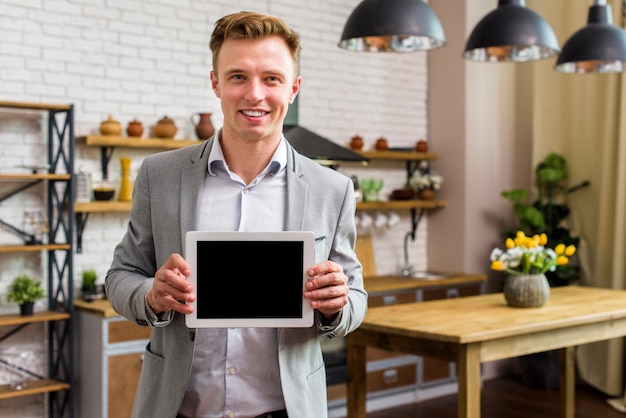 Smiley man holding tablet mockup