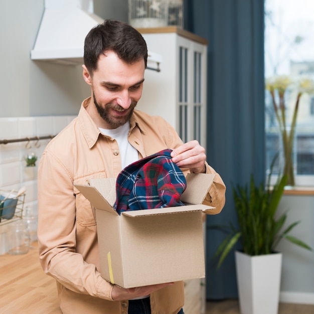 Smiley man liking what he ordered online