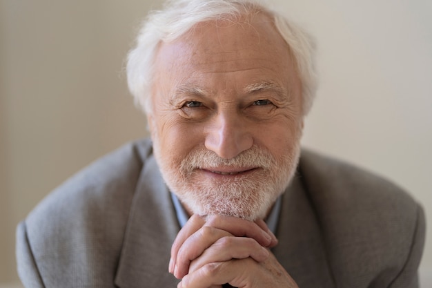 Smiley man posing indoors front view