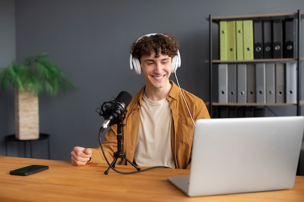 smiley man recording podcast medium shot