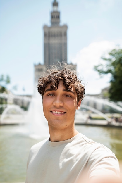 Smiley man taking selfie front view