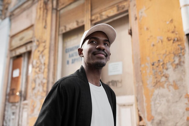 Smiley man wearing cap medium shot