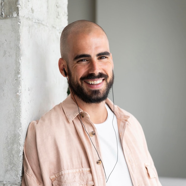 Smiley man wearing headphones