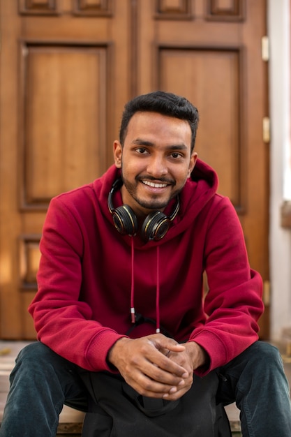 Smiley man with headphones front view