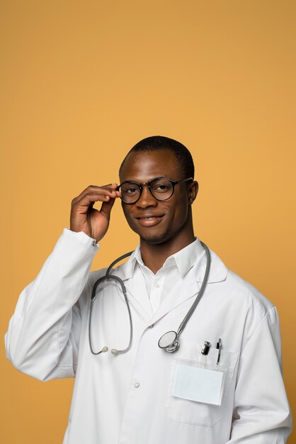 Smiley man with lab coat medium shot