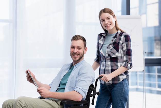 Smiley man and woman posing