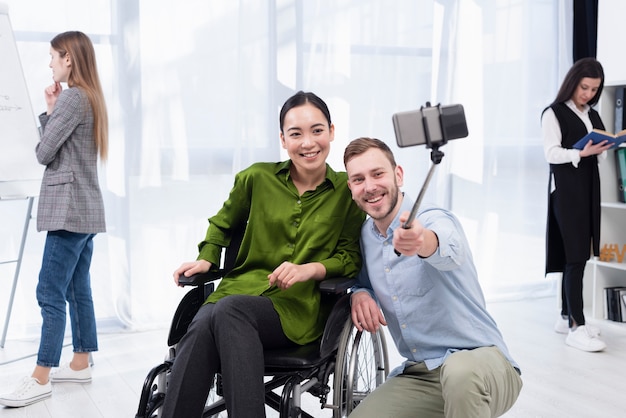 Smiley man and woman taking selfie