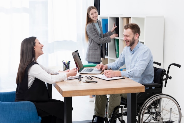 Smiley man working indoors