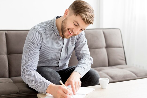 Smiley man writing