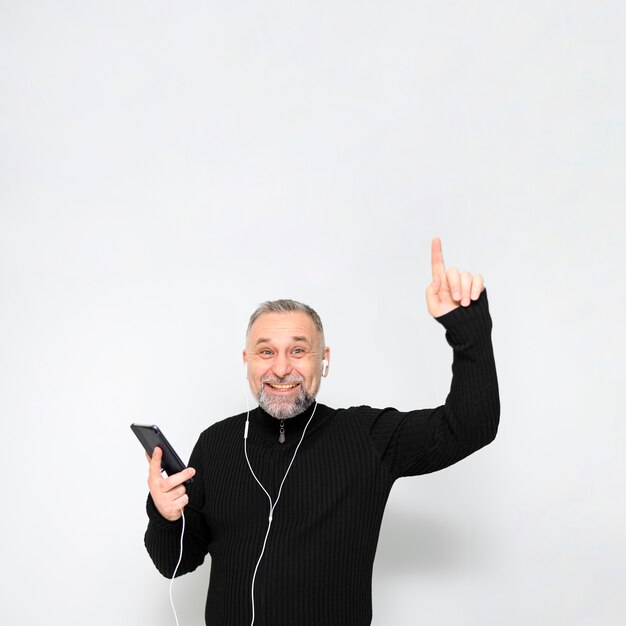 Smiley mature man listening to music