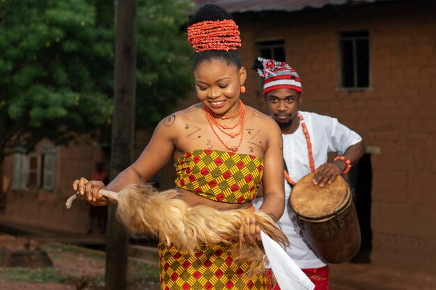 Smiley nigerian woman dancing medium shot