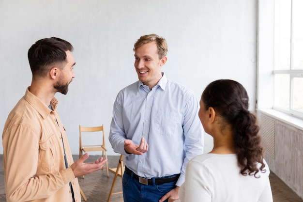 Smiley people attending group therapy