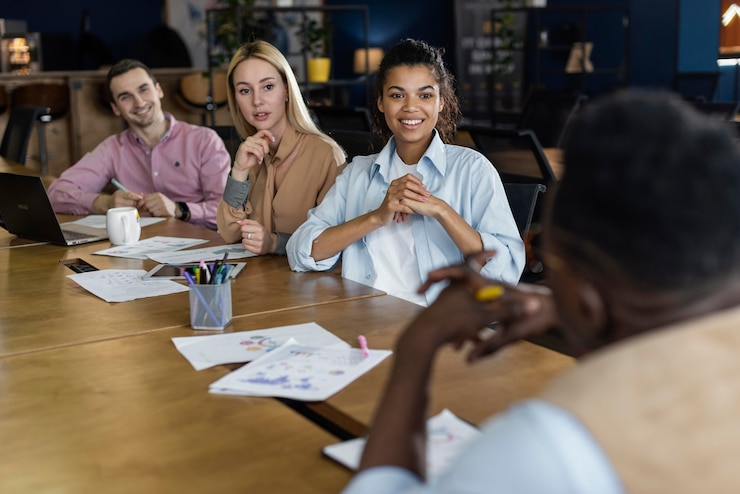 Free Photo smiley people having an office meeting