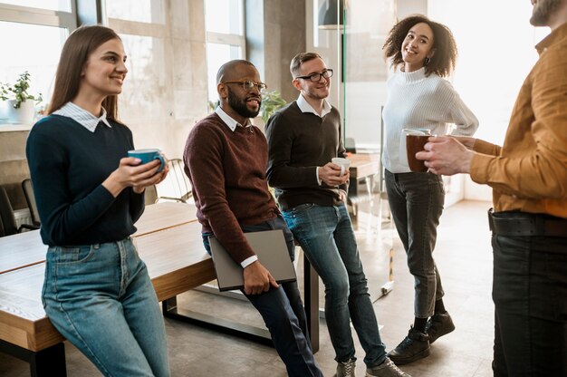 smiley people during a meeting with coffee