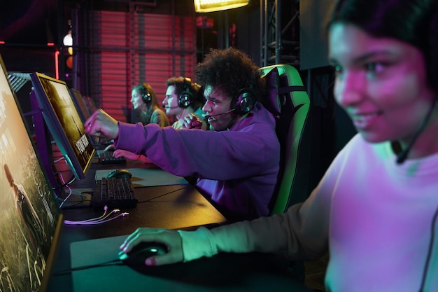 smiley people playing videogame side view