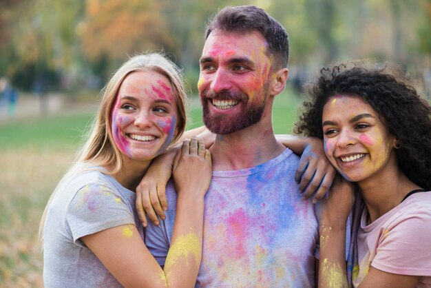 Smiley people posing at holi