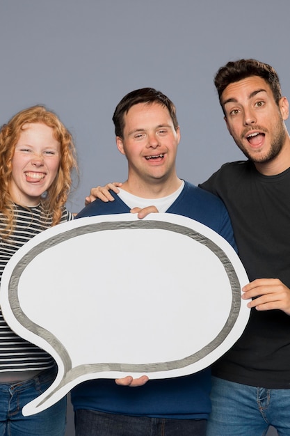 Smiley people posing together with a speech bubble