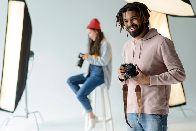 Smiley photographer in studio