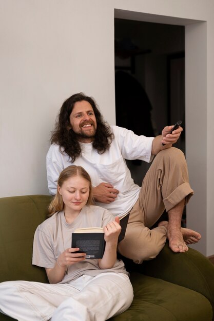 Smiley roommates laying on couch