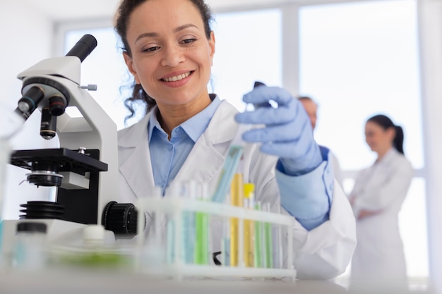 Smiley scientist with microscope