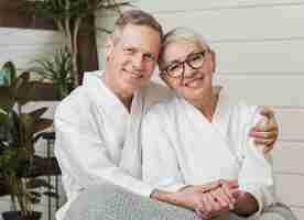 Free photo smiley senior couple holding hands