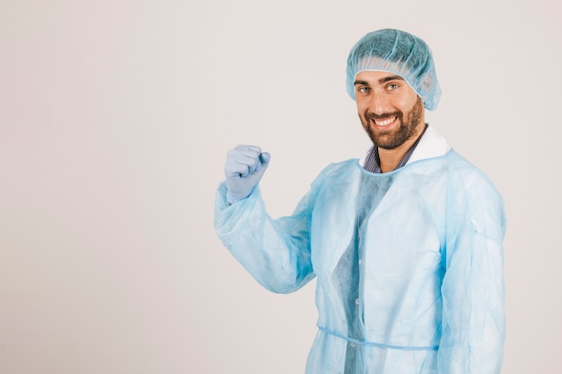 Smiley surgeon rising the fist
