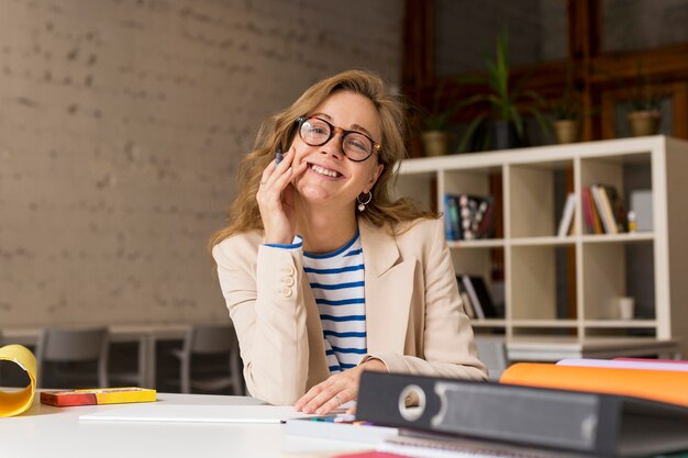 Smiley teacher at desk