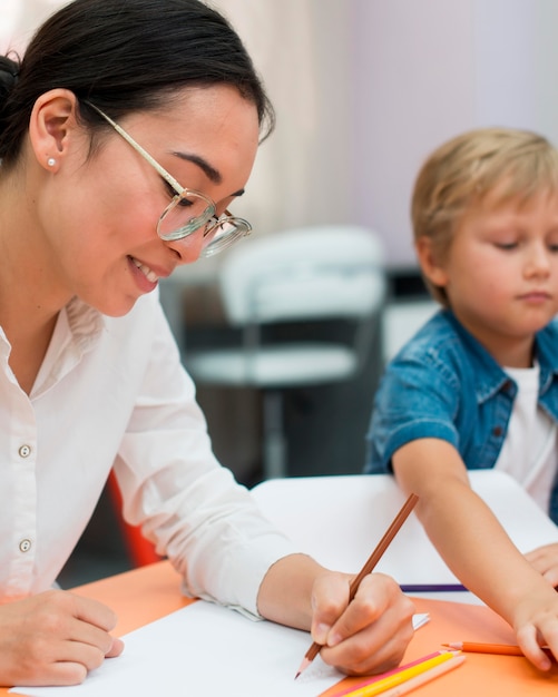 Smiley teacher doing her class with kids