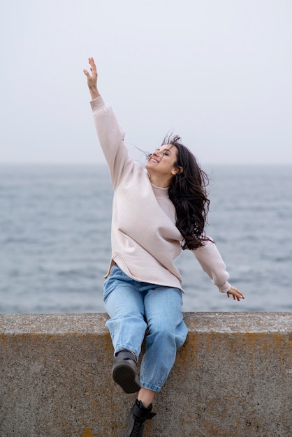 Smiley woman on bridge