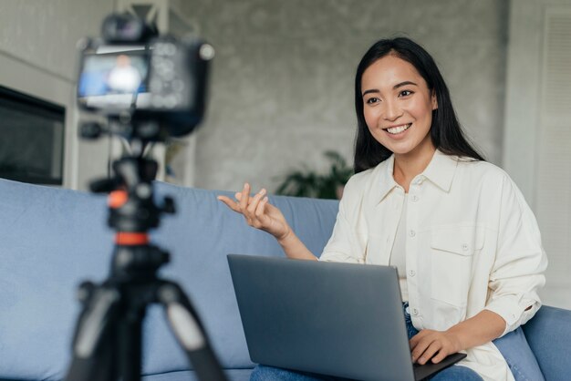 Smiley woman doing a vlog