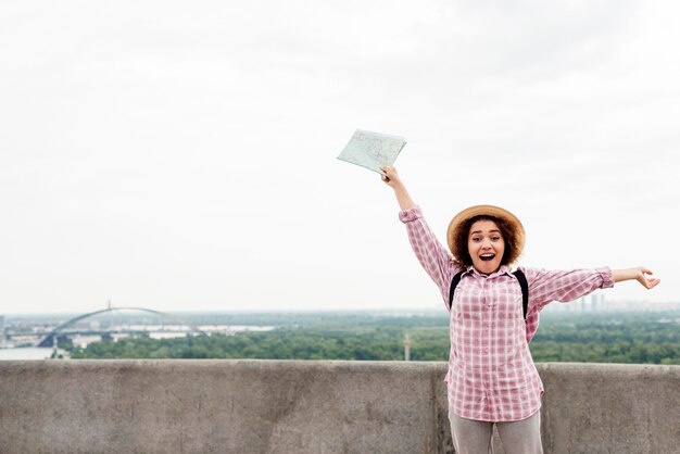 Free Photo smiley woman enjoying her vacation with copy space